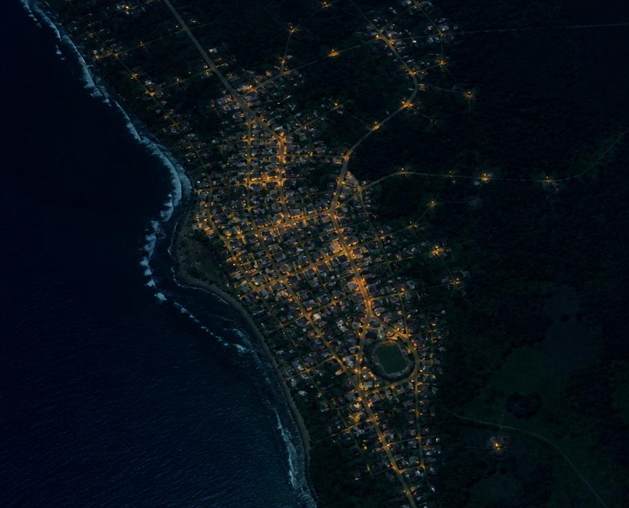 Stylized night satellite view of a coastal town near the IBIITECH head office